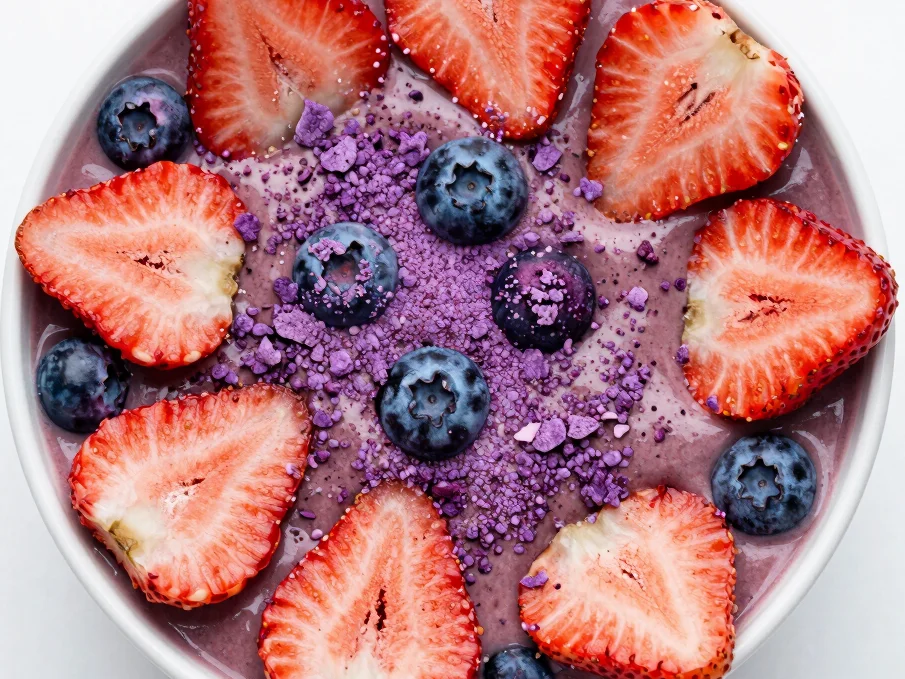 Overhead shot of a vibrant smoothie bowl topped with freeze-dried