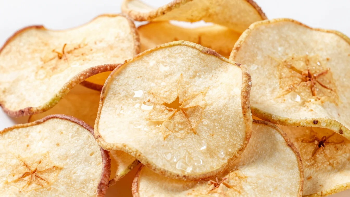 Detailed image of freeze-dried apple slices, light and airy texture.